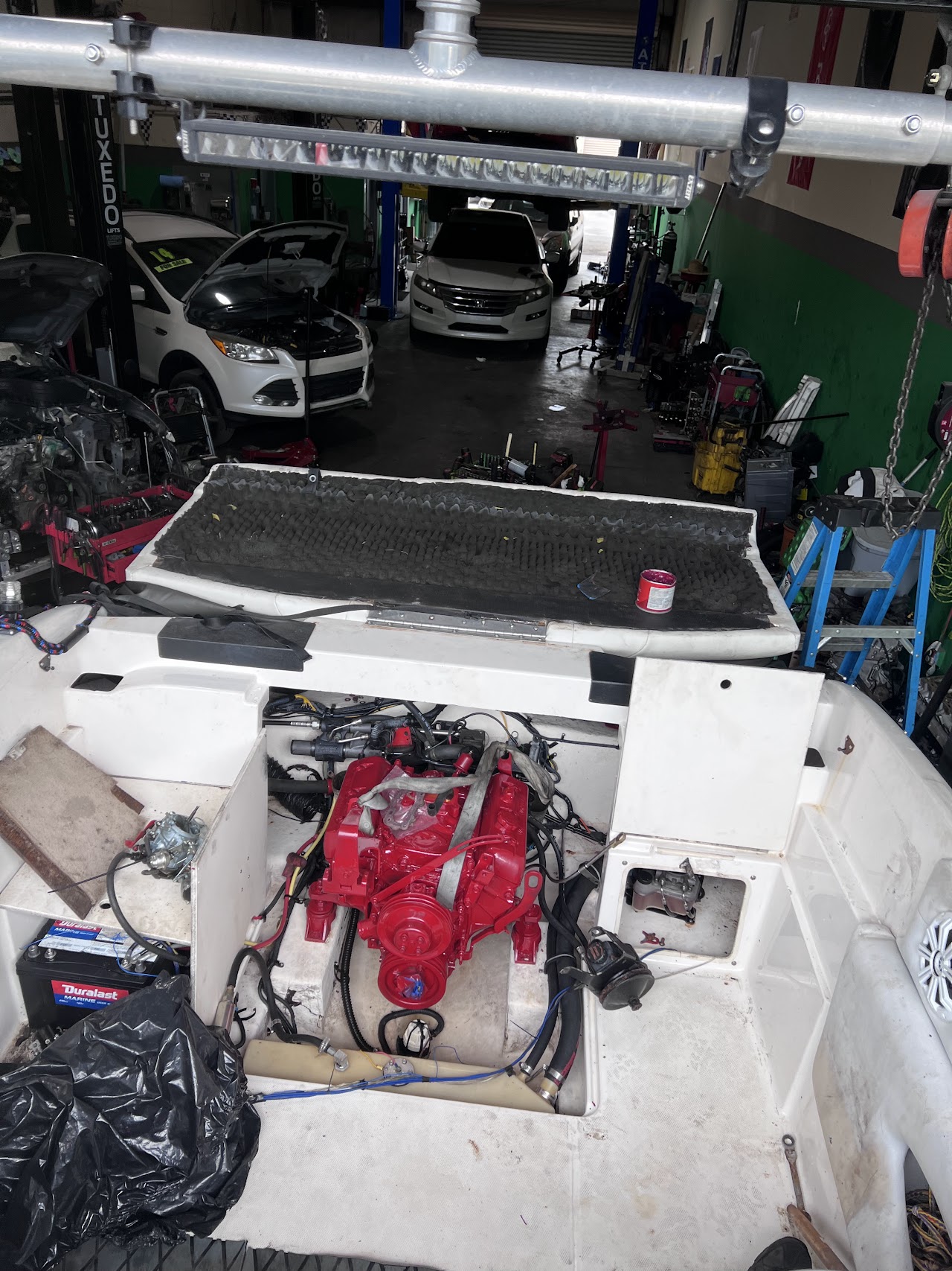 Spacious and clean Auto Mechanic Express shop interior with vehicles on lifts